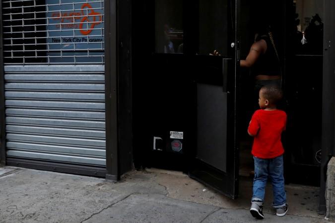 A child is seen entering the Cayuga Center, which provides foster care and other services to immigrant children separated from their families in New York City, U.S., June 20, 2018. Kid.