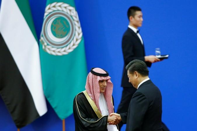 Chinese President Xi Jinping and Saudi Arabia's Foreign Minister Adel bin Ahmed Al-Jubeir shake hands at a China Arab forum at the Great Hall of the People in Beijing, China, July 10, 2018. CHina Arab forum