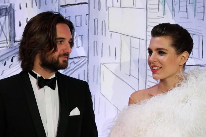 Charlotte Casiraghi (R) and her partner Dimitri Rassam (L) pose upon their arrival for the annual Rose Ball at the Monte-Carlo Sporting Club in Monaco, on March 24, 2018. The Rose Ball is one of the major charity events in Monaco. Charlotte Casiraghi