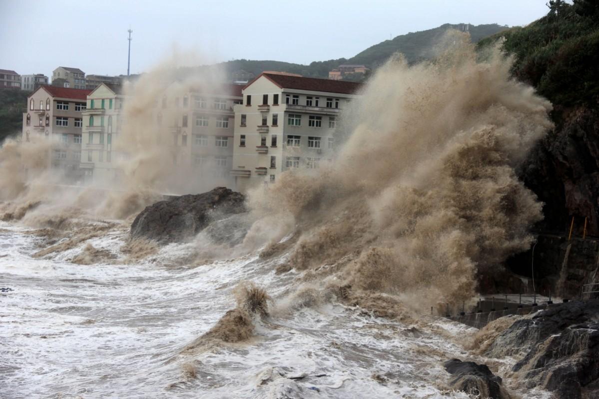 Waves caused by typhoon Maria batter the coast near Wenling, east China's Zhejiang province on July 11 Typhoon maria