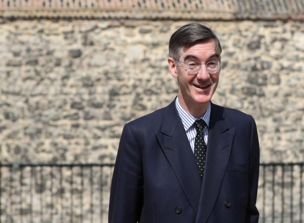 Brexit campaigner Jacob Rees-Mogg talks to the media outside the Houses of Parliament after David Davis resigns from government, in London, Brexit campaigner Jacob Rees-Mogg