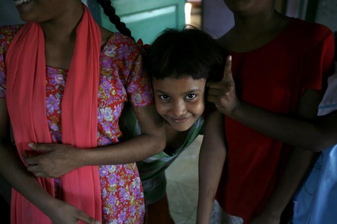 Sangeeta Mandal, a child of a sex worker, smiles at Soma Home in the eastern Indian city of Kolkata July 14, 2007. Soma Home, set up to protect young girls from being sexually abused or trafficked, is named after a girl who died due to lack of medical attention. Child trafficking