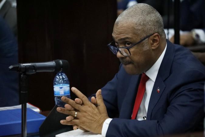 Haitian Prime minister Jack Guy Lafontant gestures during a meeting with members of the Parliament in Port-au-Prince, Haiti, Jack Guy Lafontant
