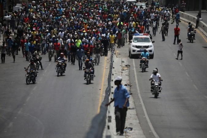 Demonstrators march along a street during a protest in Port-au-Prince, Haiti Demonstrators march along a street during a protest in Port-au-Prince, Haiti