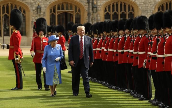 U.S. President Donald Trump and Britain's Queen Elizabeth II inspect a Guard of Honour, formed of the Coldstream Guards at Windsor Castle on July 13, 2018, in Windsor, England. Donald Trump, Queen