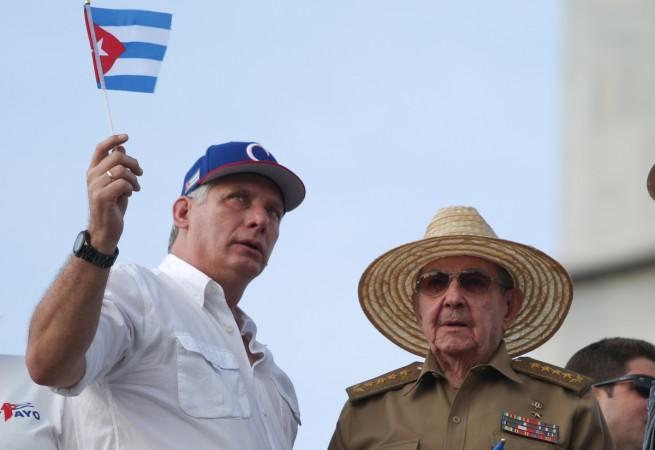 Cuba's First Secretary of the Communist Party and former President Raul Castro (R), speaks to Cuba's President Miguel Diaz-Canel as they watch the May Day rally in Havana, Cuba Raul Castro (R), speaks to Cuba's President Miguel Diaz-Canel