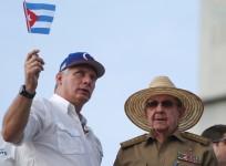 Raul Castro (R), speaks to Cuba's President Miguel Diaz-Canel