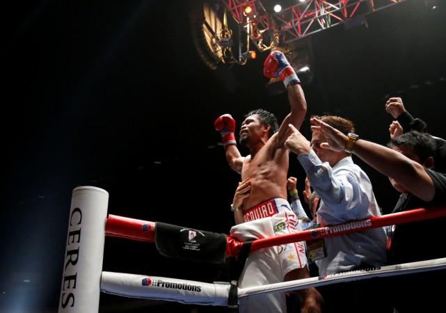 Boxing - WBA Welterweight Title Fight - Manny Pacquiao v Lucas Matthysse - Axiata Arena, Kuala Lumpur, Malaysia - July 15, 2018 Manny Pacquiao celebrates after defeating Lucas Matthysse Manny Pacquiao v Lucas Matthysse