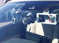 Sensors are seen mounted on the windshield of a self-driving car