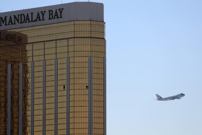 Air Force One departs Las Vegas past the broken windows on the Mandalay Bay hotel where shooter Stephen Paddock conducted his mass shooting Mandalay Bay Hotel