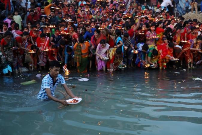 Hindu devotees release oil lamps to the Buriganga river as they observe Bipottarini Puja in Dhaka, Bangladesh, July 17, 2018. Hindus at the Bipottarini Puja on Buriganga river in Dhaka
