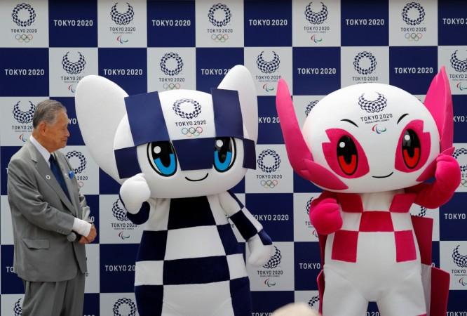 Yoshiro Mori, president of the Tokyo 2020 Organising Committee, stands next to Tokyo 2020 Olympic Games mascot Miraitowa and Paralympic mascot Someity during the mascots' debut in Tokyo, Japan, July 22, 2018 Yoshiro Mori, president of the Tokyo 2020 Organising Committee