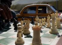 Indian commuters play chess