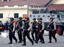 Police are seen inside the Mobile Police Brigade