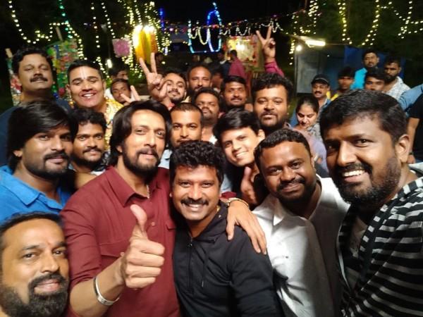 Kiccha Sudeep and Prem posing for the camera after completing the shooting of The Villain. Sudeep, Prem with the team members of The Villain