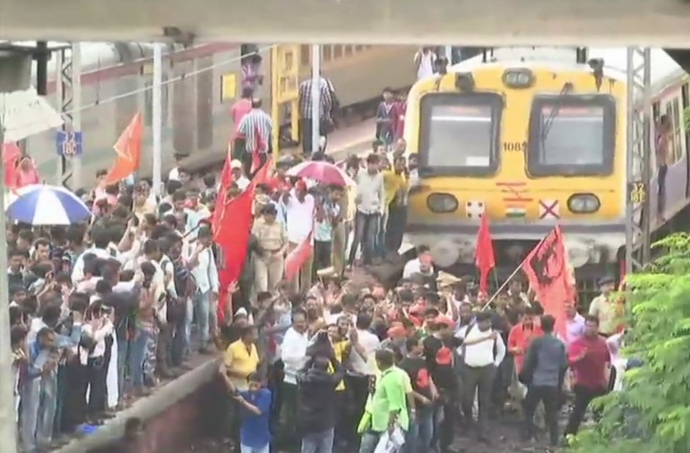 Workers of Maratha Kranti Morcha block a local train in Thane. maratha bandh