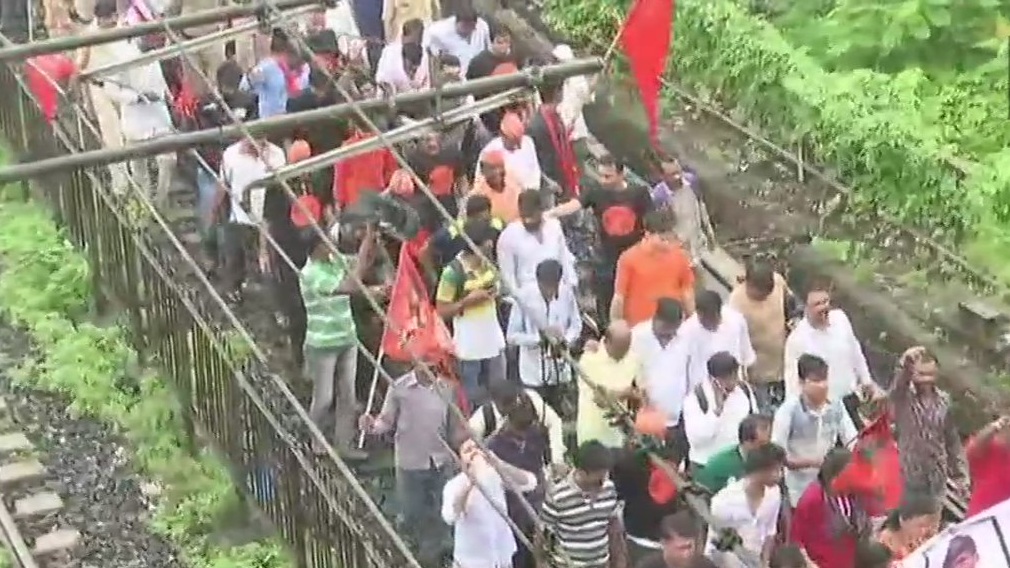 Workers of Maratha Kranti Morcha block a local train in Thane. maratha bandh