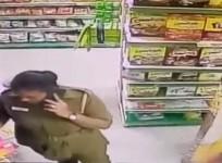 CCTV grab of the policewoman stealing