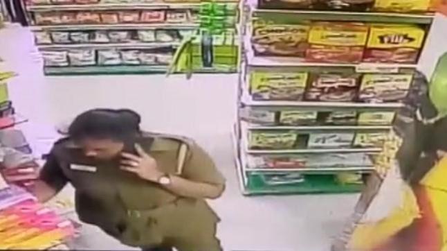 A CCTV grab from the supermarket shows the policewomen shoplifting. CCTV grab of the policewoman stealing