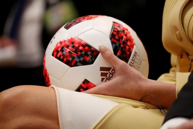 U.S. First Lady Melania Trump holds a football thrown to her by U.S. President Donald Trump Adidas football with transmitter chip