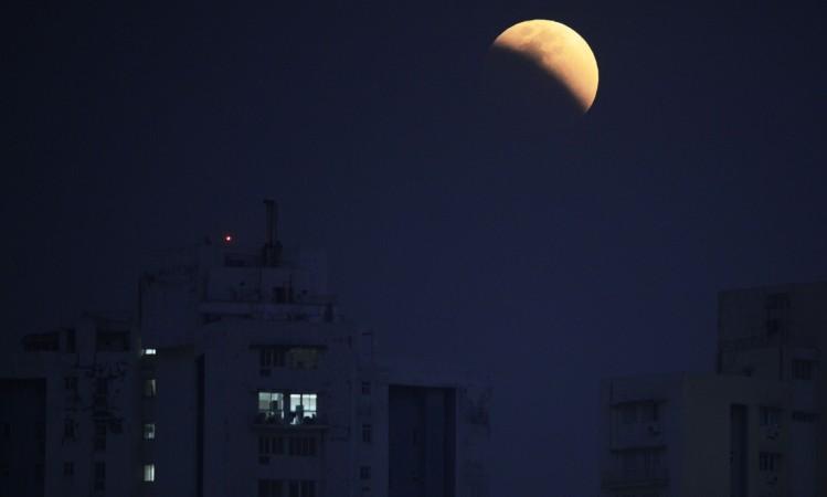 The moon is seen during a lunar eclipse referred to as the 'super blue blood moon', in Kolkata on January 31, 2018. Skywatchers were hoping for a rare lunar eclipse that combines three unusual events -- a blue moon, a super moon and a total eclipse -- which was to make for a large crimson moon viewable in many corners of the globe. blood moon