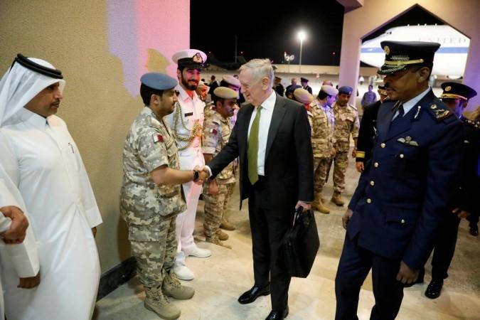 FILE PHOTO: U.S. Defense Secretary James Mattis (C) is greeted by military dignitaries as he arrives at Al Udeid Air Base in Doha, Qatar April 21, 2017. Mattis in Qatar