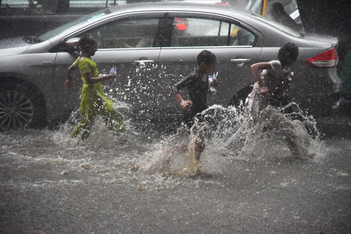 Kids playing in Delhi rains
