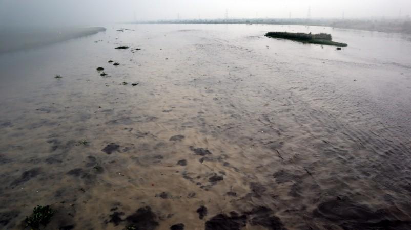A view of an overflowing Yamuna river, in New Delhi on July 28, 2018. Water released from Haryana's Hathnikund added to the continued rains have led the Yamuna river to breach its danger-level mark here at 10 am on Saturday. Yamuna river water level rises