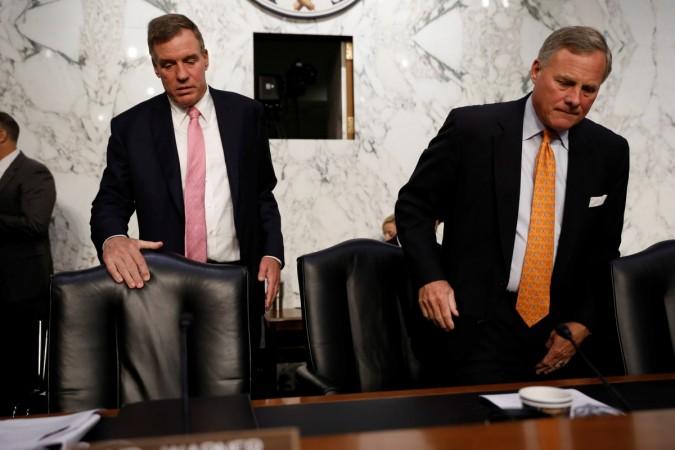 Sen. Richard Burr (R-NC), at right, and Sen. Mark Warner (D-VA), arrive for a hearing of the Senate Intelligence Committee on Capitol Hill in Washington, U.S., July 25, 2018. Senate Intelligence Committee