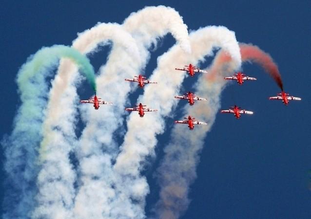Pilots from the Surya-Kiran aerobatic demonstration team of the Indian Air Force perform during the Surya-Kiran aerobatic demonstration by the Indian Air Force at Aero Show 2017