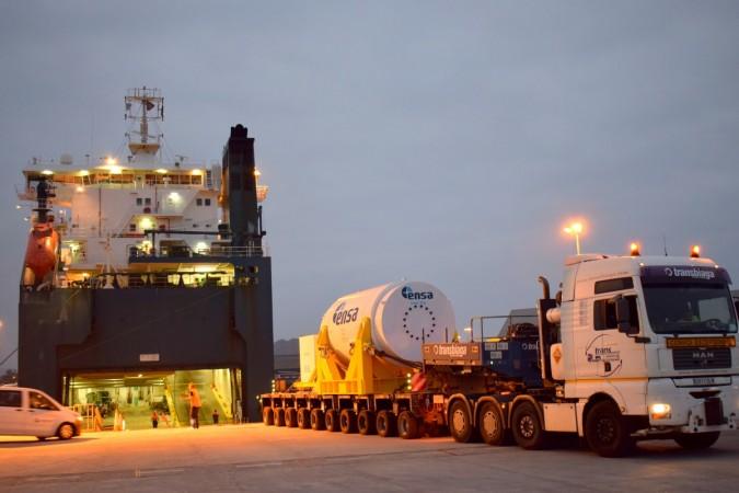 Casks being loaded onto a barge Transporting casks