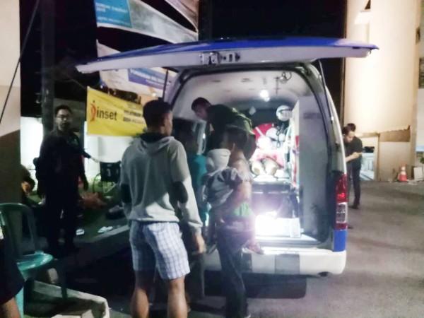 People are seen next to the ambulance near the Golden Palace Hotel after an earthquake hit Lombok Island, Indonesia Indonesia earthquake