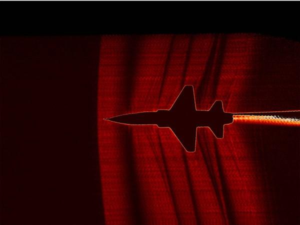 NASA used a U.S. Air Force Test Pilot School T-38 aircraft and cameras with a special filter on the ground to capture images of shockwaves coming off the aircraft sound waves