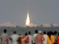 Onlookers watch an ISRO launch at Sriharikota