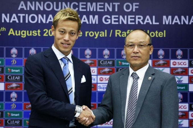 Keisuke Honda poses with military police chief and president of the football federation of Cambodia Keisuke Honda