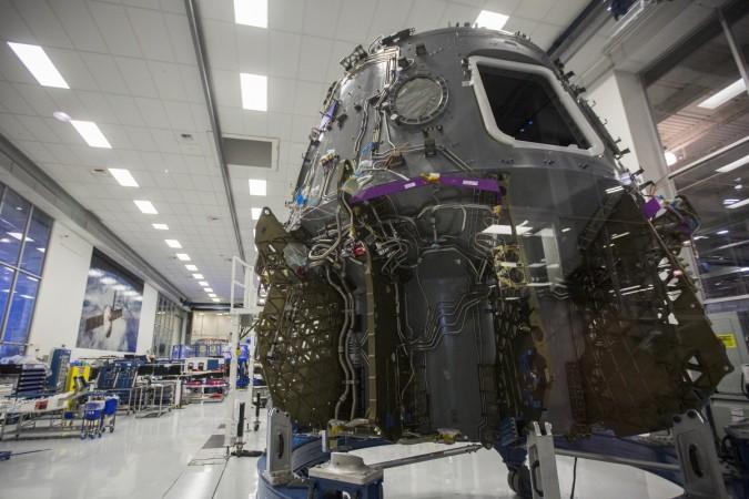 The Crew Dragon spacecraft is seen under construction in a clean room Crew Dragon