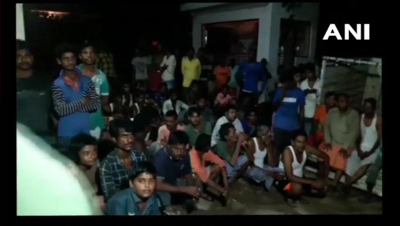 Neighbours gathered outside Manoj Kushwaha's house. Allahabad family death