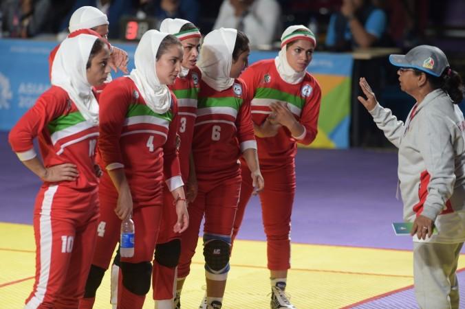 Iran kabaddi women's team listening to their coach's instruction at Asian Games 2018. Iran kabaddi team