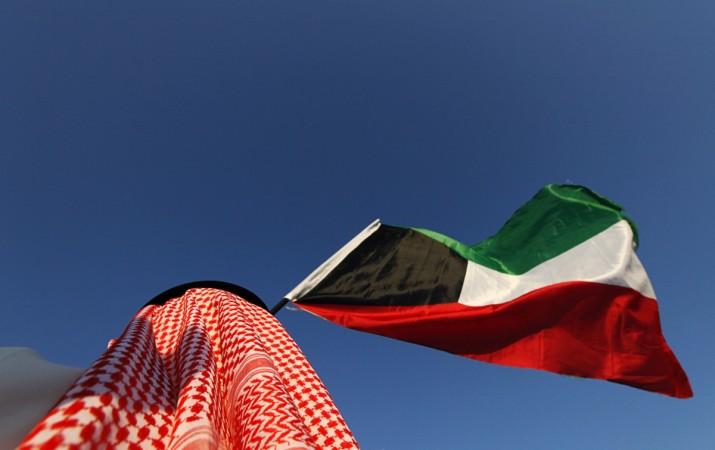 A Kuwaiti national holding the flag. Kuwaiti flag