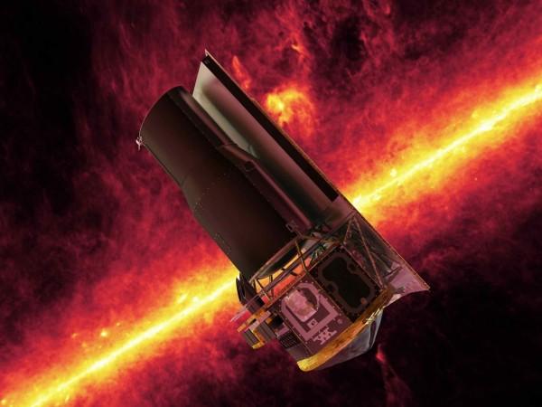 The Spitzer Space Telescope whizzes in front of a brilliant, infrared view of the Milky Way galaxy's plane in this artistic depiction. Spitzer Space Telescope
