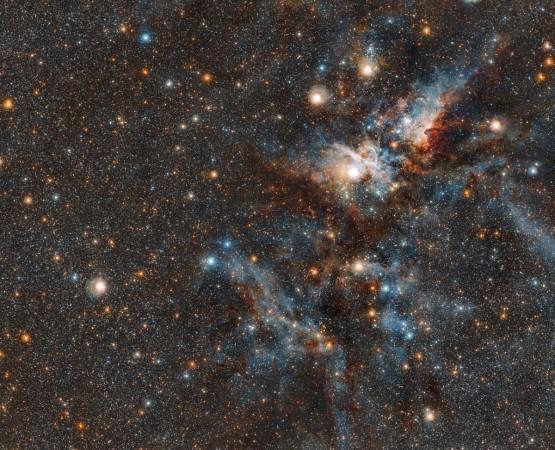 This wider coverage area reveals even more stars from the crowded neighbourhood surrounding the Carina nebula. Captured by VISTA, the world's largest infrared survey telescope, we witness the dramatic evolution of this living stellar city, where stars form and perish side by side Carina Nebula