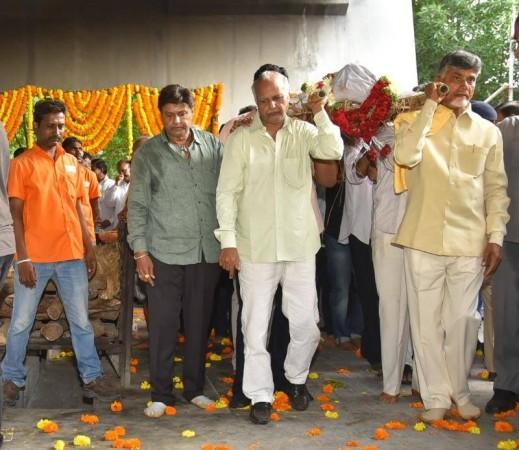 N Chandrababu Naidu seen carrying of his brother-in-law Nandamuri Harikrishna's body N Chandrababu Naidu seen carrying of his brother-in-law Nandamuri Harikrishna's body