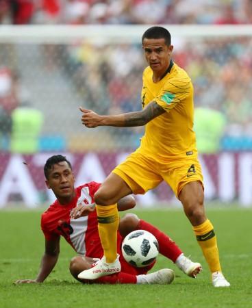 Tim Cahill of Australia is challenged by Renato Tapia of Peru during the 2018 FIFA World Cup Russia Tim Cahill