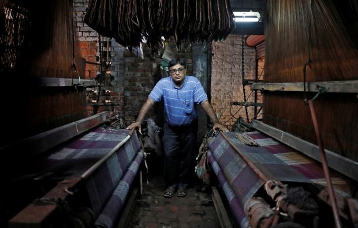 Tilak Raj Bathla, 50, owner of a weaving factory, poses for a picture at a closed section of his factory, in Panipat in the northern state of Haryana, India, August 29, 2018. Tilak Raj