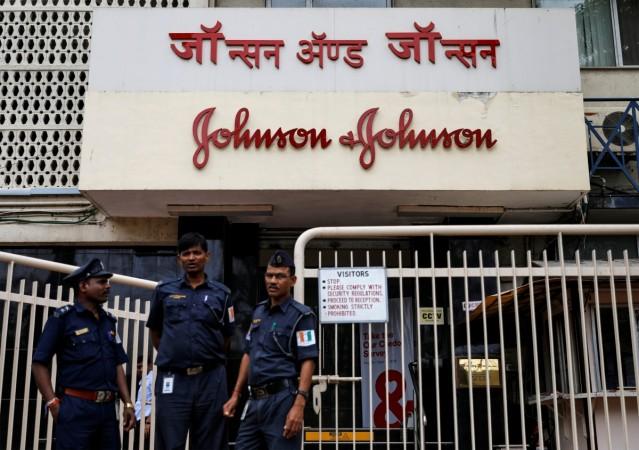 Security guards stand outside the office of Johnson & Johnson in Mumbai, India, August 29, 2018. Johnson & Johnson