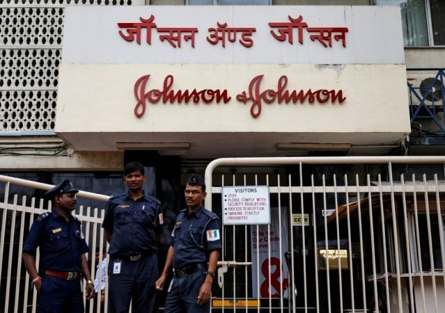 Security guards stand outside the office of Johnson & Johnson in Mumbai, India. Johnson & Johnson