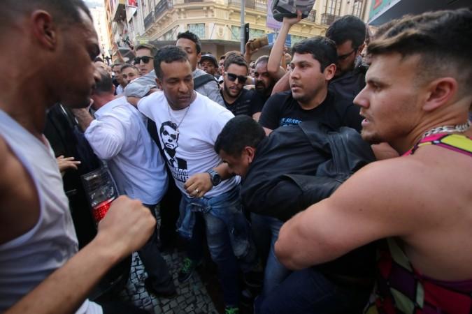People surround a man suspected of stabbing Brazilian presidential candidate Jair Bolsonaro Jair Bolsonaro