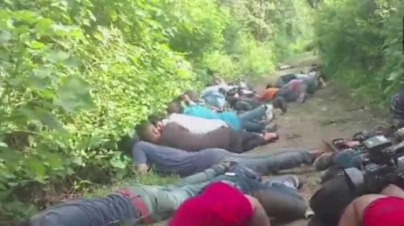 Locals and journalists take cover during the encounter. kakriyal encounter