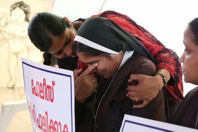 A woman consoles a nun during a protest demanding justice after an alleged sexual assault of a nun by a bishop in Kochi, in the southern state of Kerala, India, September 13, 2018. Kerala nun rape