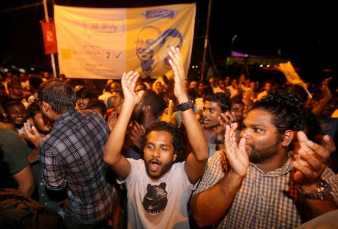 Supporters of Maldivian joint-opposition presidential candidate Mohamed Solih celebrate in Maldives Supporters of Maldivian joint-opposition presidential candidate Mohamed Solih celebrate in Maldives
